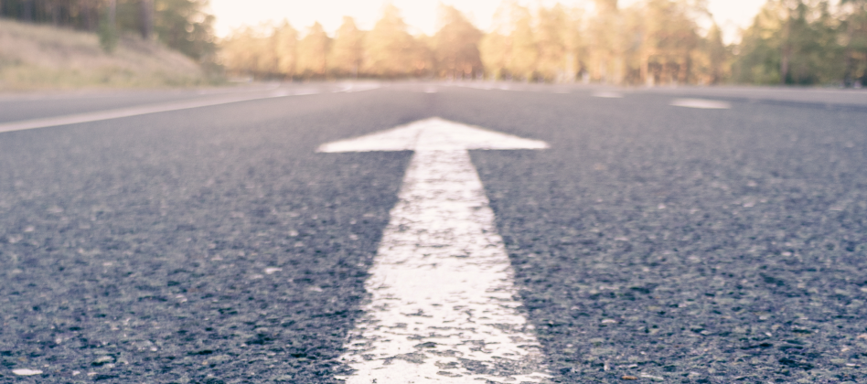 conceptual-image-of-an-asphalt-road-and-a-directio-2022-11-16-17-05-54-utc 1
